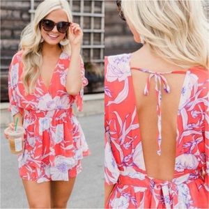 Floral open back romper with ruffle bottom